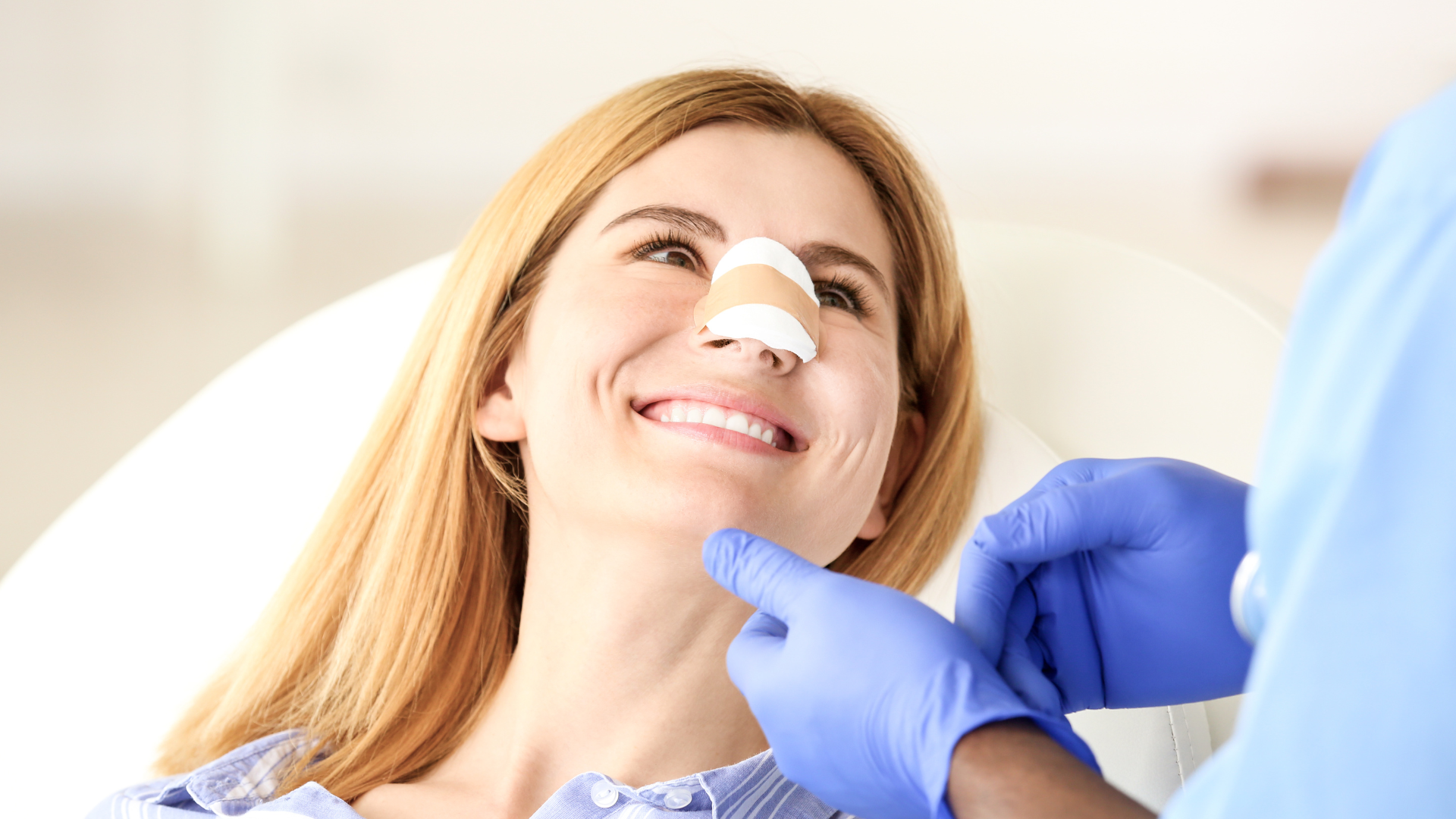 Woman with bandage on nose